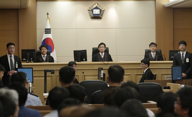 Judges sit to preside over verdicts for the sunken South Korean ferry Sewol's crew members who are charged with negligence and abandonment of passengers in the disaster at Gwangju High Court in Gwangju, South Korea, Tuesday, April 28, 2015.