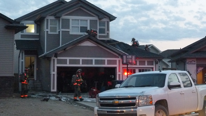 Saskatoon fire officials say improperly disposed smoking material was the cause of a garage fire Monday evening.