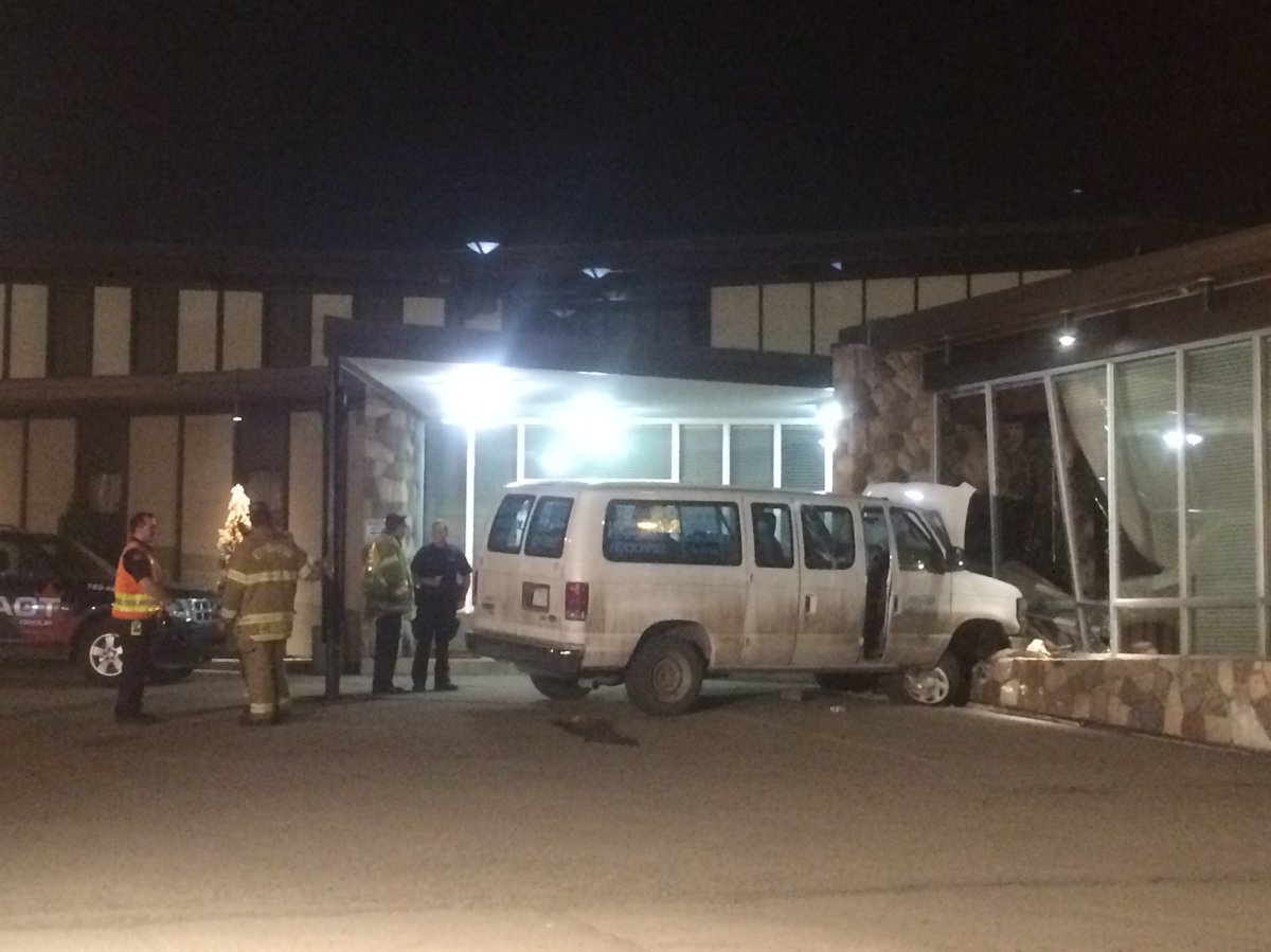 Two people were taken to hospital on Sunday night after a van crashed into a funeral home in central Edmonton. April 19, 2015.