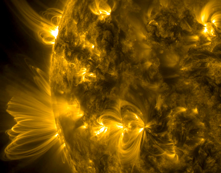 NASA's Solar Dynamics Observatory captured expanding coronal loops  at the edge of the Sun on Oct. 14-15, 2014. 