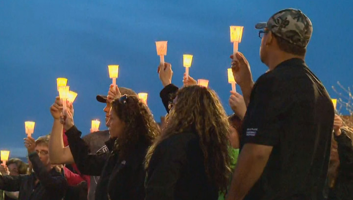 An emotional candlelight vigil in Tisdale, Sask. remembers a mother and her three children killed in a murder-suicide.