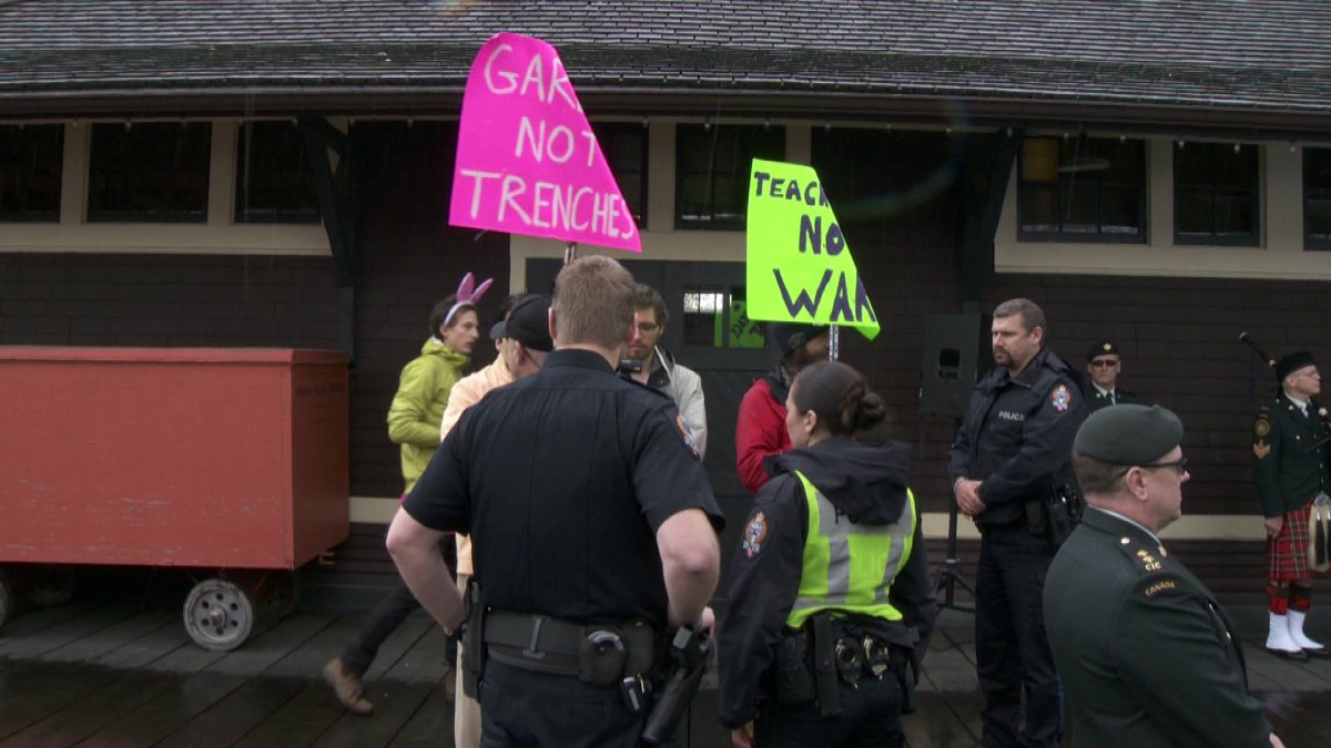 Protesters interrupt the opening of a First World War memorial trench in Port Moody on April 4, 2015.