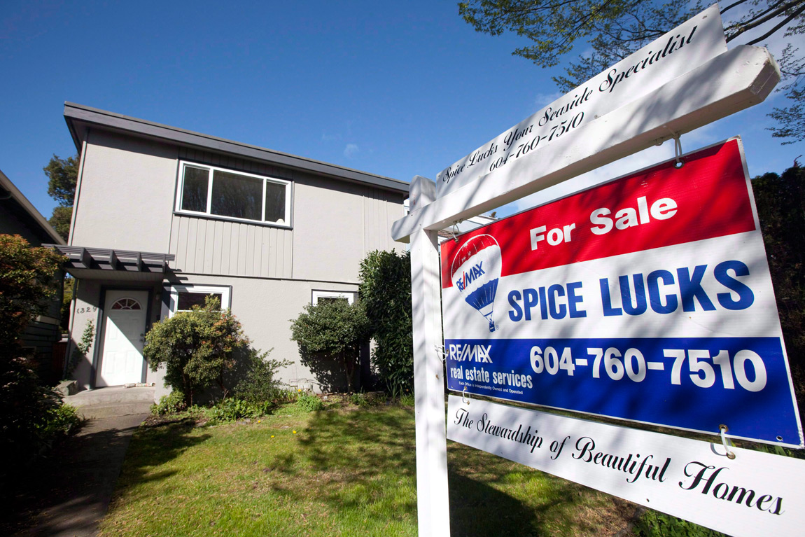 A for sale sign sits outside a home in Vancouver on April 8, 2010. 