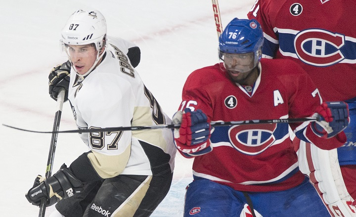 Montreal Canadiens' P.K. Subban, right, defends against Pittsburgh Penguins' Sidney Crosby during an NHL hockey game in Montreal, Saturday, January 10, 2015. THE CANADIAN PRESS .