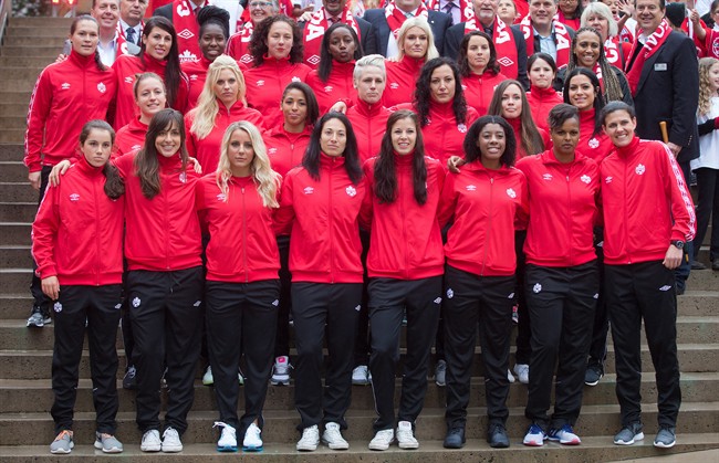 Members of the Canadian national women's soccer team stand for a photograph after the roster for the 2015 FIFA Women's World Cup was announced, in Vancouver, B.C., on Monday April 27, 2015. THE CANADIAN PRESS/Darryl Dyck.