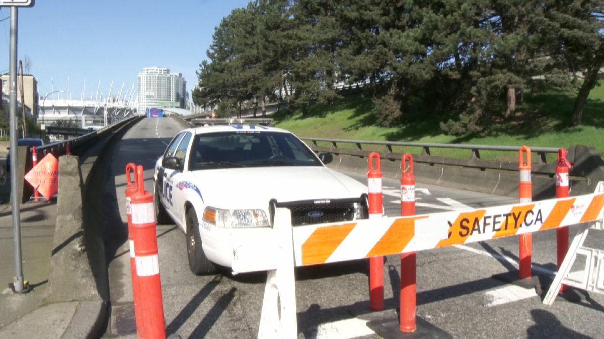Police enforce the closure of the Georgia Viaduct on April 5, 2015, the beginning of two weeks of on-and-off closures for filming of the movie Deadpool.