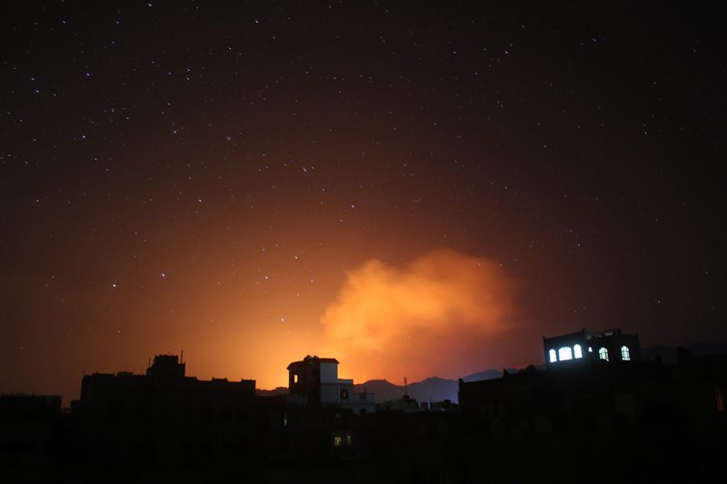 In this photo taken on Friday, April 17, 2015, fire and smoke rises after a Saudi-led airstrike on Sanaa, Yemen. Iran's foreign minister urged U.N. Secretary-General Ban Ki-moon on Friday to try to end "the senseless aerial attacks" in Yemen by a Saudi-led coalition and establish a cease-fire. 
