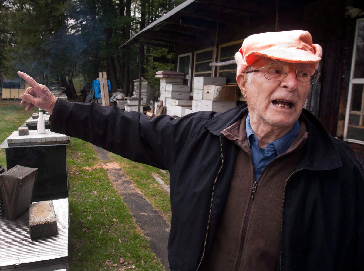 Vladimir Katriuk points at his honeybee farm in Ormstown, Que., Wednesday, April 25, 2012. 