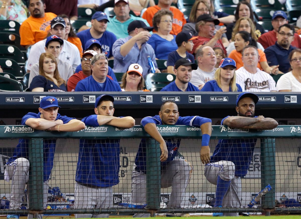 Toronto Blue Jays players and fans watch the final inning of a baseball game against the Houston Astros, Sunday, May 17, 2015, in Houston. 