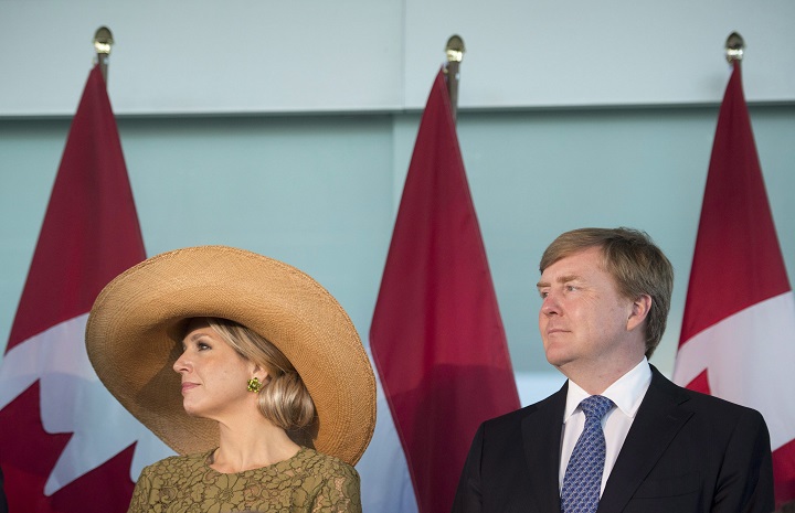 King Willem-Alexander and Queen Maxima of of the Netherlands stand together during a signing of a new memorandum of understanding allowing exchanging opportunities between Canada and the Netherlands at the University of Waterloo in Waterloo, Ont. on Thursday, May 28, 2015. THE CANADIAN PRESS/Hannah Yoon.