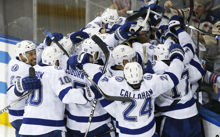 The Tampa Bay Lightning celebrate their 2-0 win over the New York Rangers in Game 7 of the Eastern Conference final during the NHL hockey Stanley Cup playoffs, Friday, May 29, 2015, in New York.