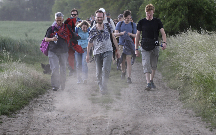Participants take part in a 20-mile walk between the town of Pohorelice and the city of Brno, Czech Republic, Saturday, May 30, 2015. 