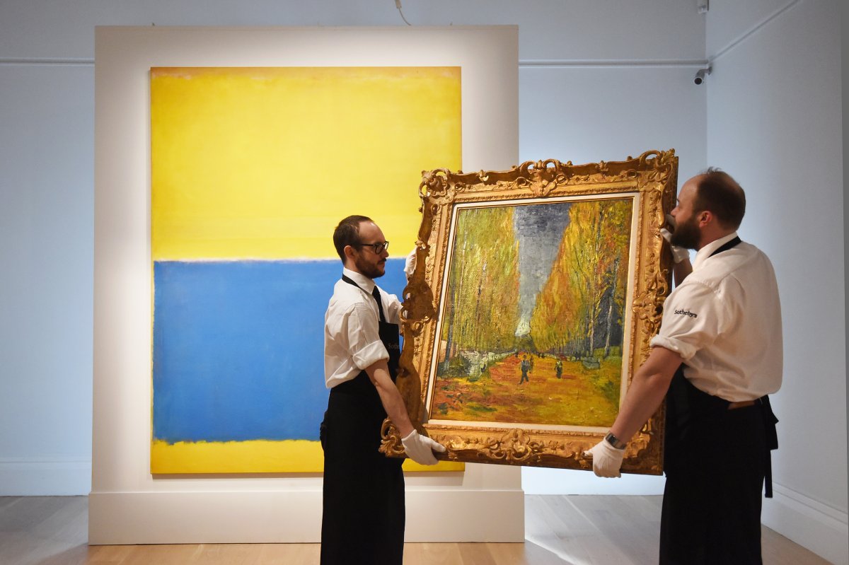 Gallery technicians carry Vincent Van Gogh's 'L'Allee des Alyscamps', painted in 1888.