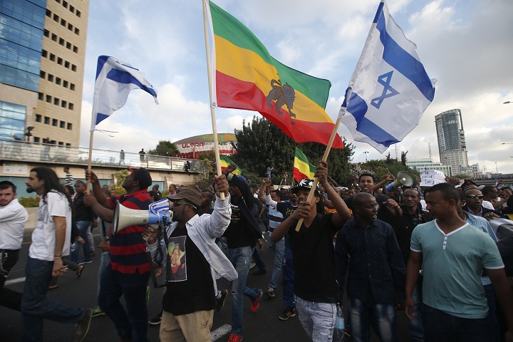 Israelis take part in a demonstration in Tel Aviv called by members of the Ethiopian community against alleged police brutality and institutionalised discrimination, on May 3, 2015.