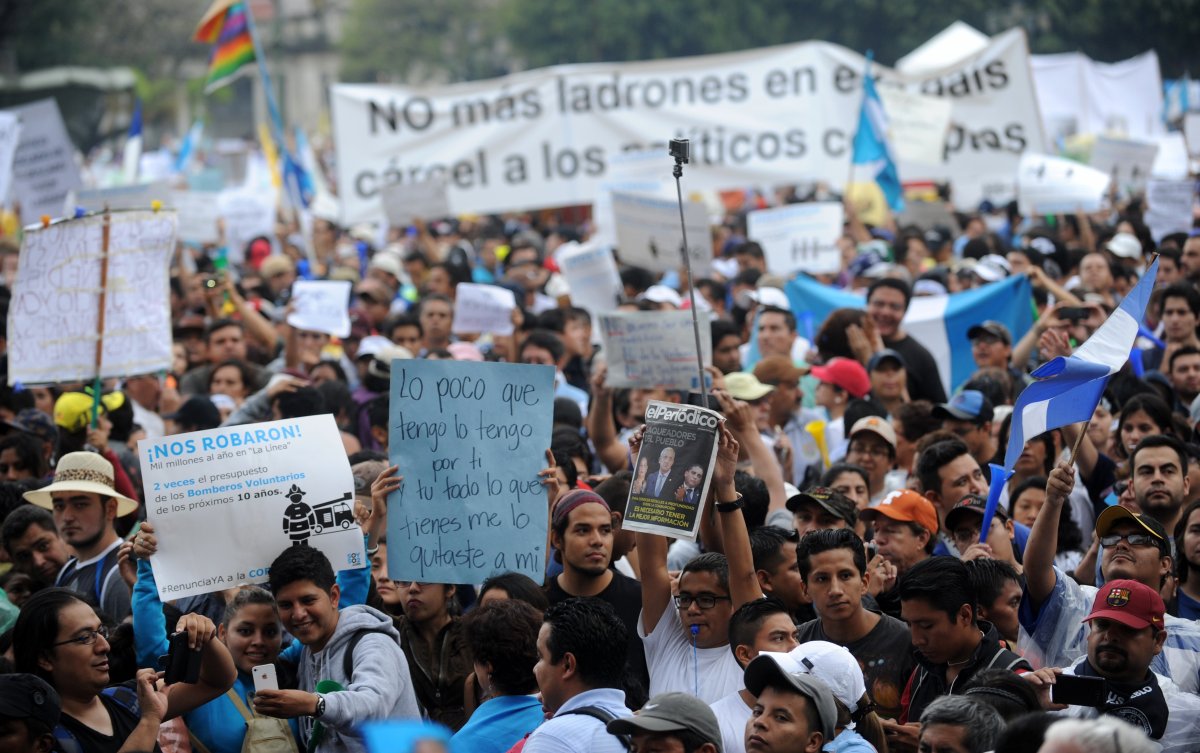 People demonstrate in demand of the resignation of Guatemalan President Otto Perez as a corruption scandal rocks the government, at Constitution Square in Guatemala City on May 16, 2015.