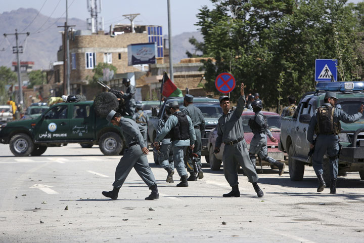 Afghan security forces inspect the site of an explosion in Kabul, Afghanistan on Wednesday, May 13, 2015. 