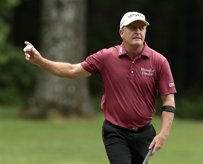 Fred Funk waves to fans after making a birdie on the sixth hole during the Regions Tradition Champions Tour golf tournament at Shoal Creek Country Club, Saturday, May 16, 2015, in Birmingham, Ala. 