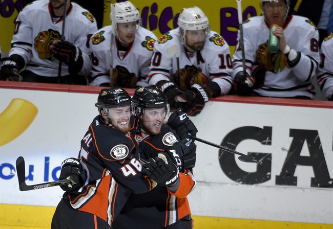 Anaheim Ducks defenceman Cam Fowler, right, celebrates with Jiri Sekac after scoring against the Chicago Blackhawks during the first period in Game 5 of the Western Conference final of the NHL hockey Stanley Cup playoffs in Anaheim, Calif., on Monday, May 25, 2015. (AP Photo/Mark J. Terrill).