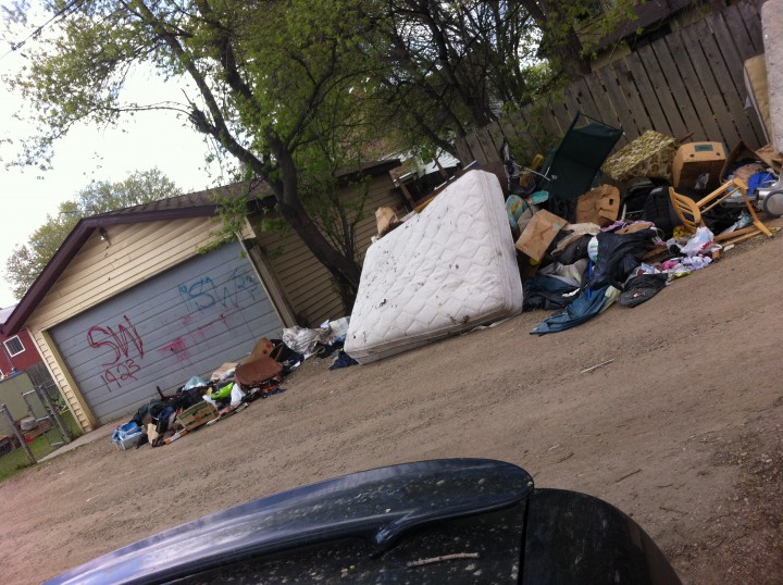 Garbage pile accumulates in Saskatoon back alley - image