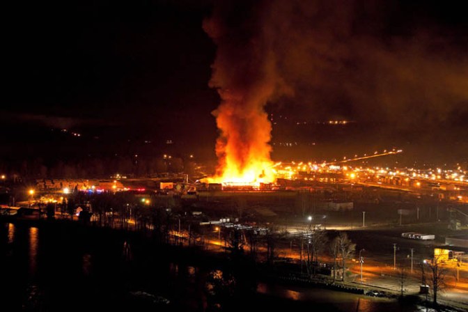 A large fire burns at the Lakeland Mills sawmill in Prince George, B.C., on Tuesday April 24, 2012. THE CANADIAN PRESS/Andrew Johnson