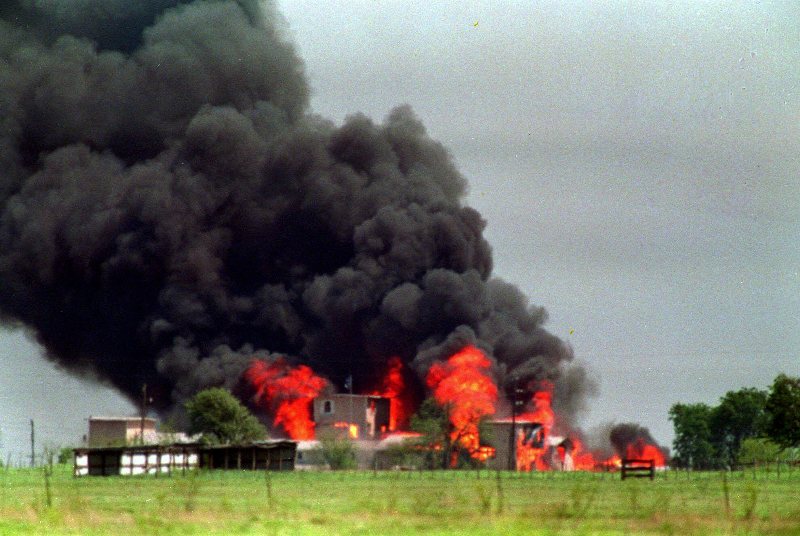 The Branch Davidian compound in Waco, Texas, is shown engulfed by flames in this April 20, 1993, photo. Retreating from its past denials, the FBI is acknowledging that federal agents fired one or more incendiary tear gas canisters during the standoff with Branch Davidians, while maintaining its stance that it did not start the fire that consumed the compound with Koresh and more than 80 followers inside. 
