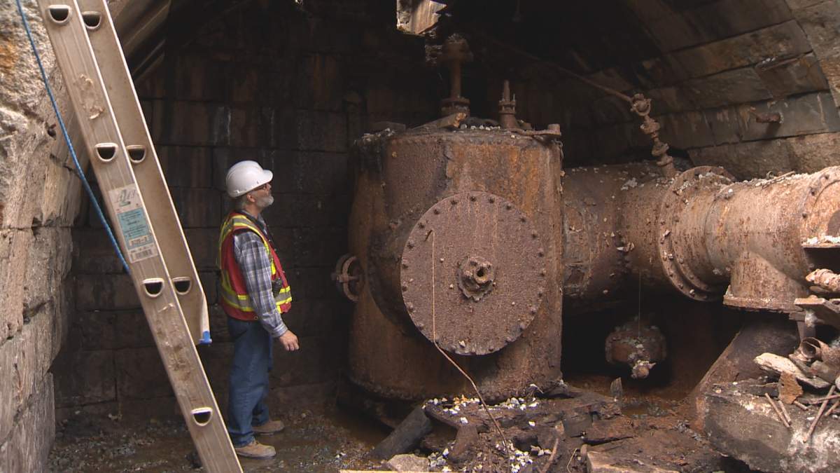 Archaeological consultant Bruce Stewart surveys the archways of the historic canal in Dartmouth.