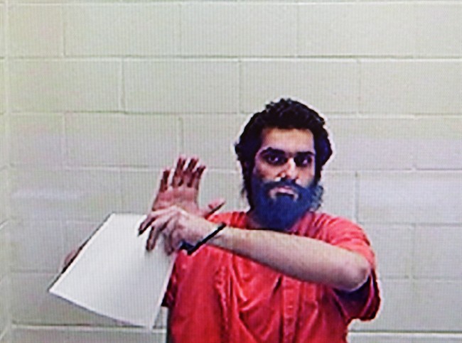 Pakistani Jahanzeb Malik appears via videolink from prison in Lindsay, Ont., at his Immigration and Refugee Board admissibility hearing in Toronto on Tuesday, May 12, 2015. Canada accuses Malik of plotting terrorist attacks in Toronto's financial district and wants to deport him. THE CANADIAN PRESS/Colin Perkel.