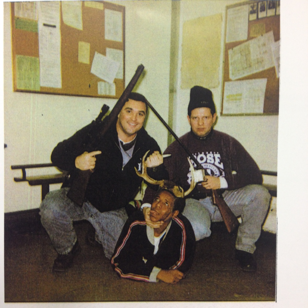 This photo, believed to have been taken between 1999 and 2003, provided by the Cook County Court, in Illinois, shows an image of Chicago Police Officers Jerome Finnigan, left, and Timothy McDermott, right, with an unidentified man, that was made public after McDermott filed a lawsuit in Cook County Circuit Court seeking to rejoin the Chicago Police Department.