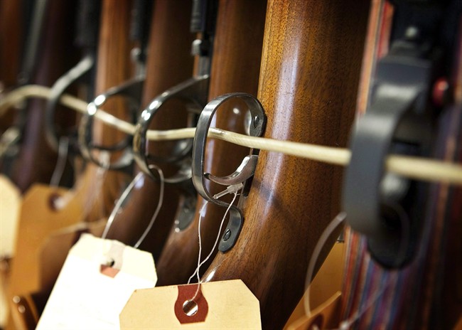 Rifles are pictured under lock and key.