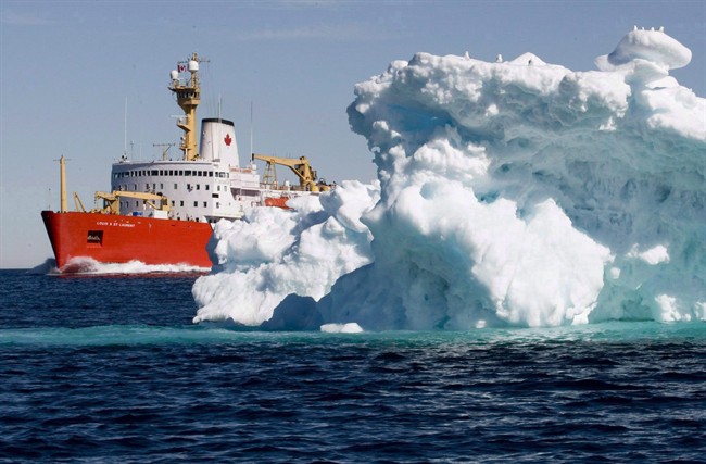 FILE - The Canadian Coast Guard icebreaker Louis S. St-Laurent sails past a iceberg in Lancaster Sound, Friday, July 11, 2008.