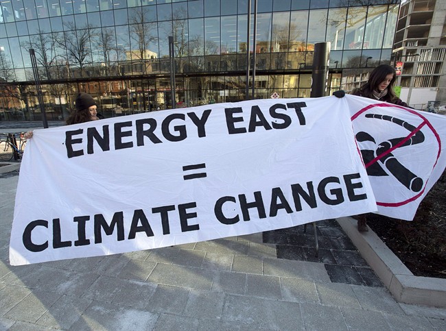 Members of Stop Energy East Halifax protest outside the library in Halifax on Monday, Jan. 26, 2015. More than 60 organizations are calling on the National Energy Board to suspend TransCanada's application for the Energy East Pipeline.
