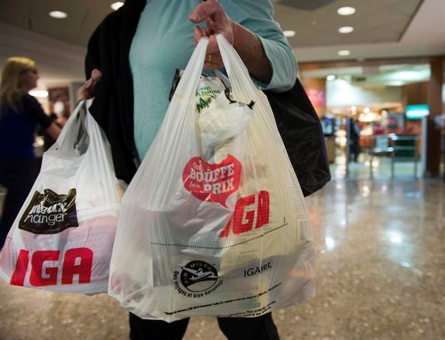 A woman leaves a grocery store Friday, May 15, 2015 in Montreal.