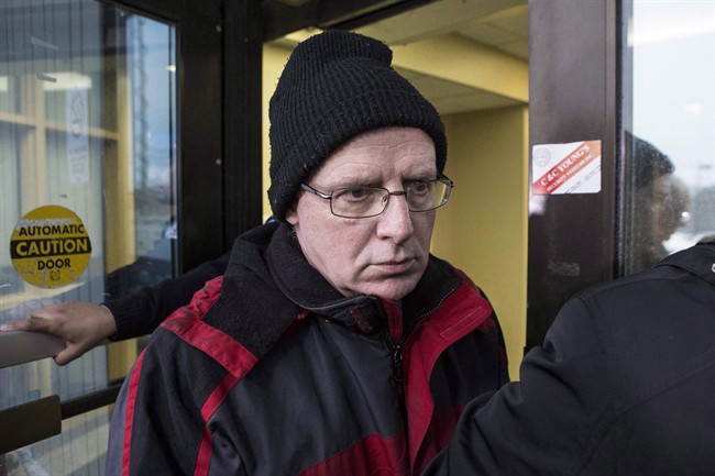 Benjamin Levin, a former Ontario deputy minister of education and a former professor at University of Toronto, is shown leaving a Toronto court on Tuesday, March 3, 2015 after pleading guilty to three charges relating to child pornography. THE CANADIAN PRESS/Chris Young.