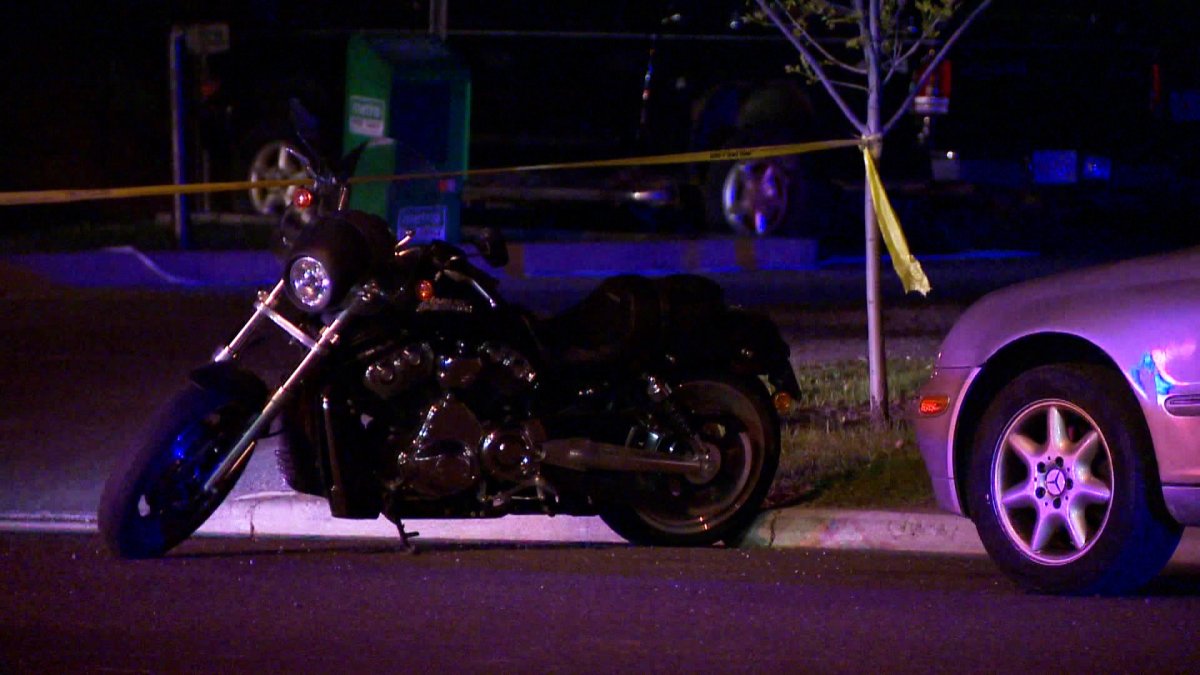 Police investigate a motorcycle crash in the intersection of 52nd Street and 23rd Avenue N.E on Wednesday, May 21, 2015. 