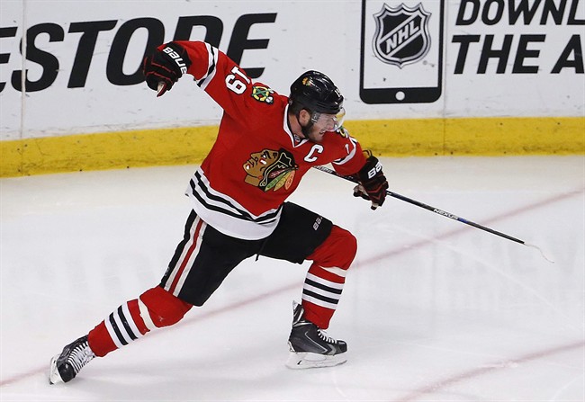 Chicago Blackhawks center Jonathan Toews celebrates his goal against the Anaheim Ducks during the third period in Game 4 of the Western Conference finals of the NHL hockey Stanley Cup playoffs, Saturday, May 23, 2015, in Chicago. 