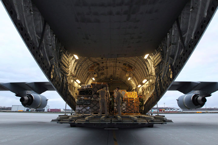 Officials say a Canadian military plane carrying an advance disaster-assistance team has landed in Kathmandu. Canadian Forces personnel load a CC-17 Globemaster at CFB Trenton on Sunday, April 26, 2015. 