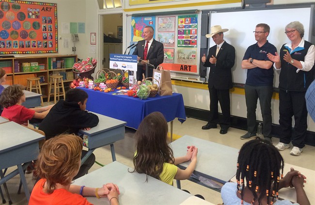 A grade 5 class at Oaklands Elementary School in Victoria participates in an event marking British Columbia's decade-long healthy eating program that brings B.C. fruits, vegetables and milk into classrooms, Monday, May 25, 2015. B.C.