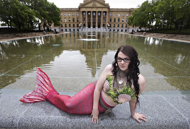 Krista Visinski wears her mermaid tail in Edmonton on Saturday May 30, 2015. Visinski is determined to be a mermaid, even if she's not allowed in the water right now.The Edmonton mother has been preparing for more than a year to become a professional sea nymph and teach exercise classes, host children's parties and appear at public events.