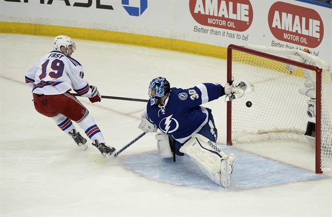New York Rangers right wing Jesper Fast (19), of Sweden, watches his goal against Tampa Bay Lightning goalie Ben Bishop (30) during the first period of Game 3 of the Eastern Conference finals of th NHL hockey Stanley Cup playoffs, Wednesday, May 20, 2015, in Tampa, Fla.