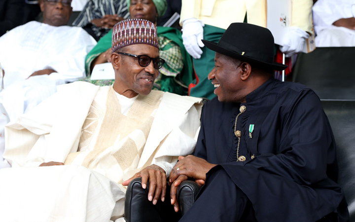 Nigerian president Muhammadu Buhari (L) speaks with outgoing president Goodluck Jonathan (R) during his inauguration in Abuja, Nigeria 29 May 2015.