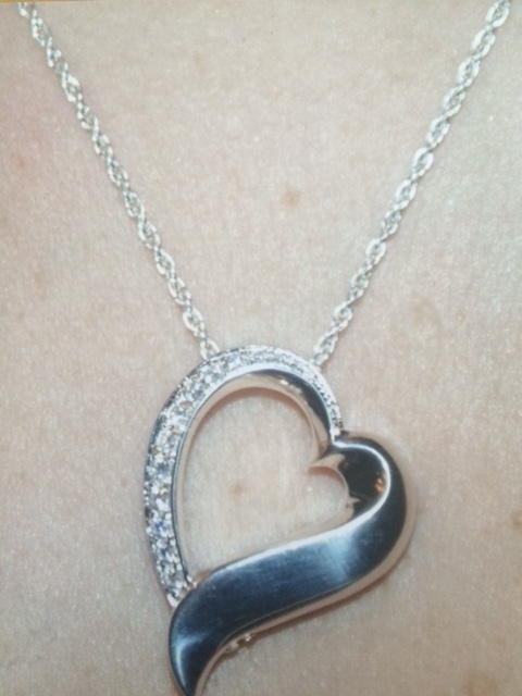 A stolen locket with son's ashes has been returned to family.