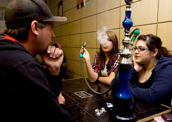 Patrons enjoy a hookah at a cafe in Scarborough, Ont. in May 2010.