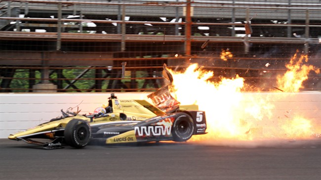 James Hinchcliffe, of Canada, hits the wall in the third turn during practice for the Indianapolis 500 auto race at Indianapolis Motor Speedway in Indianapolis, Monday, May 18, 2015.