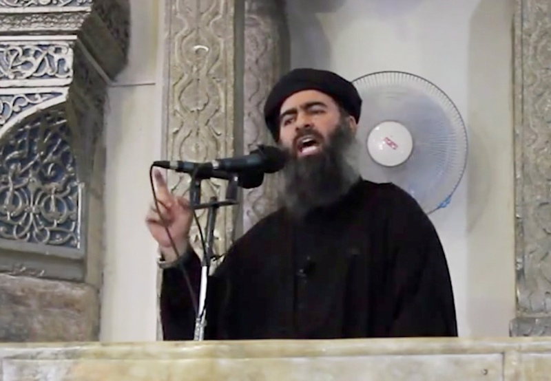 This Saturday, July 5, 2014 file image made from video posted on a militant website, which has been authenticated based on its contents and other AP reporting, purports to show the leader of the Islamic State group, Abu Bakr al-Baghdadi, delivering a sermon at a mosque in Iraq. 