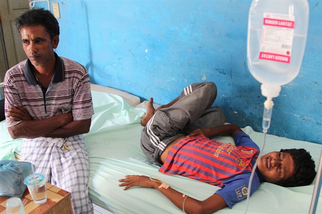 An ethnic Rohingya migrant receives medical treatment at a temporary shelter in Lhok Sukon, Aceh province, Indonesia, Monday, May 11, 2015. 
