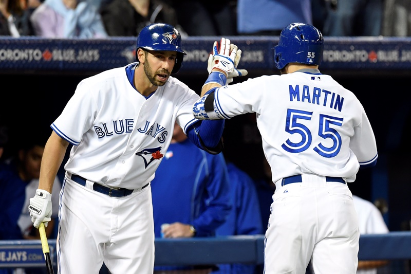 Toronto Blue Jays' Russell Martin celebrates his home run against New York Yankees starting pitcher CC Sabathia with teammate Chris Colabello in Toronto, Wednesday, May 6, 2015.
