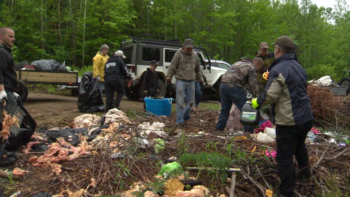 NB Jeep Club cleans up illegal dumping area in Fredericton. 