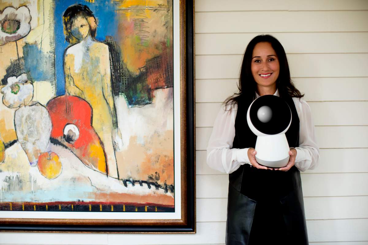Dr. Cynthia Breazeal holding her creation; a new step in social robotics called JIBO