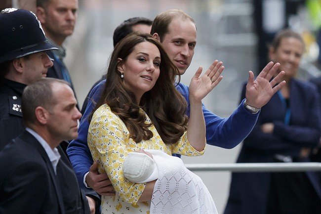 Britain's Prince William and Kate, Duchess of Cambridge and their newborn baby princess, wave to the public as they leave St. Mary's Hospital's exclusive Lindo Wing in London, Saturday, May 2, 2015. The Duchess gave birth to the Princess on Saturday morning. (AP Photo/Tim Ireland).