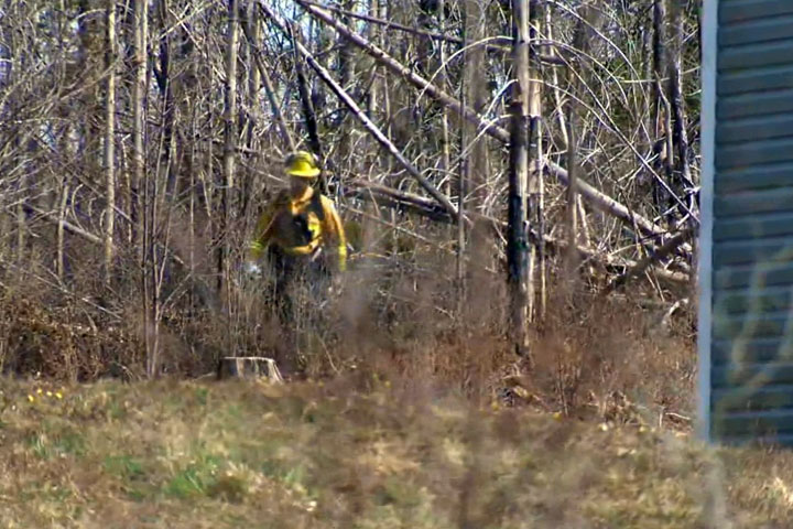 Crews are checking for hotspots Friday after a large brush fire forced the evacuation of about 200 homes east of Halifax on Thursday.